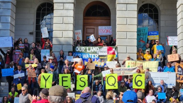 Question 6 would require the state of Maine to print the entire state constitution, including a section on tribal treaties that has been excluded for more than 100 years. Photo: Rob Laraway Group of people standing in front of Maine State House with signs Yes on Q6
