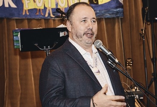 Chief Kirk Francis of the Penobscot Nation shared comments with the crowd Chief Kirk Francis of the Penobscot Nation stands at a microphone